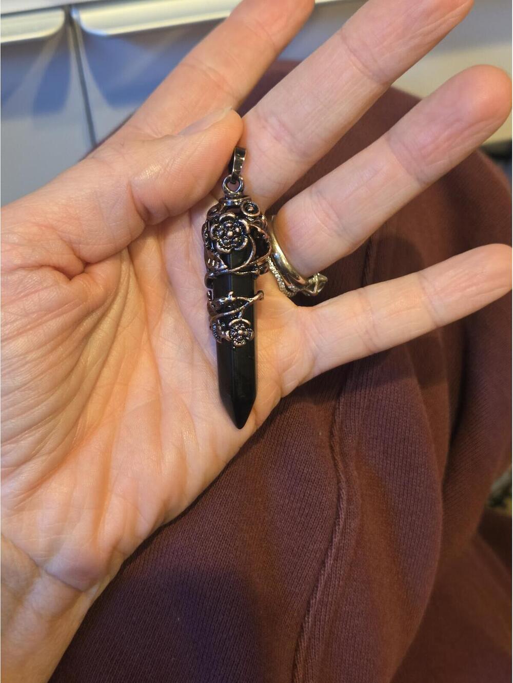 Black Point Pendant with Ornate Silver-Tone Floral Detail